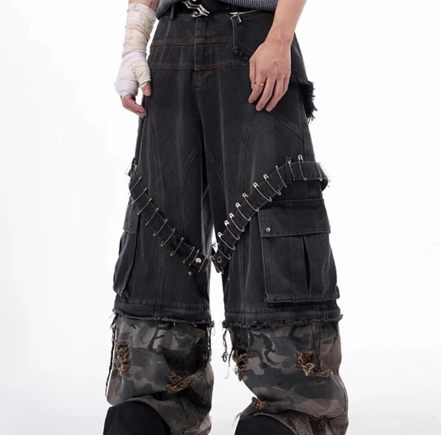 Men's grey and camouflage colour-block jeans with a structured pin and ribbon detail.