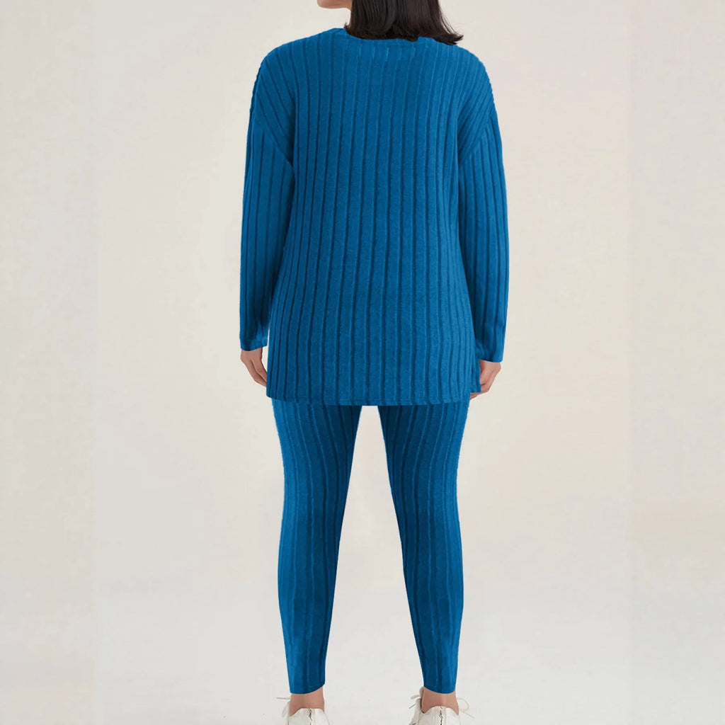 Women's black two-piece lounge set with a sunken stripe pattern on the top and matching trousers.