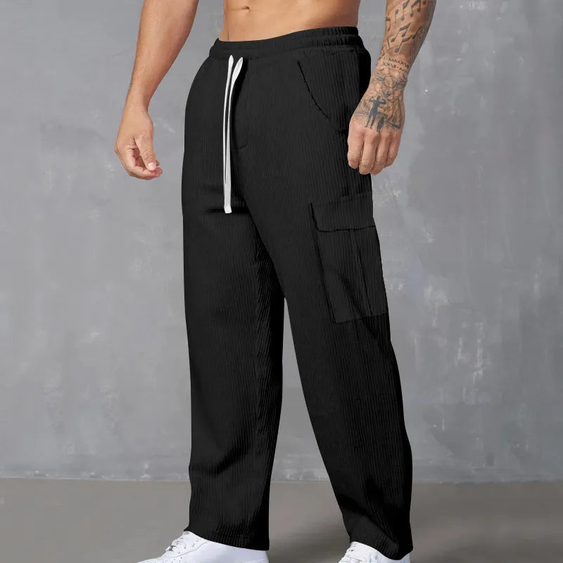 Men's corduroy cargo trousers in straight-leg wide-cut design with drawstring waist closure