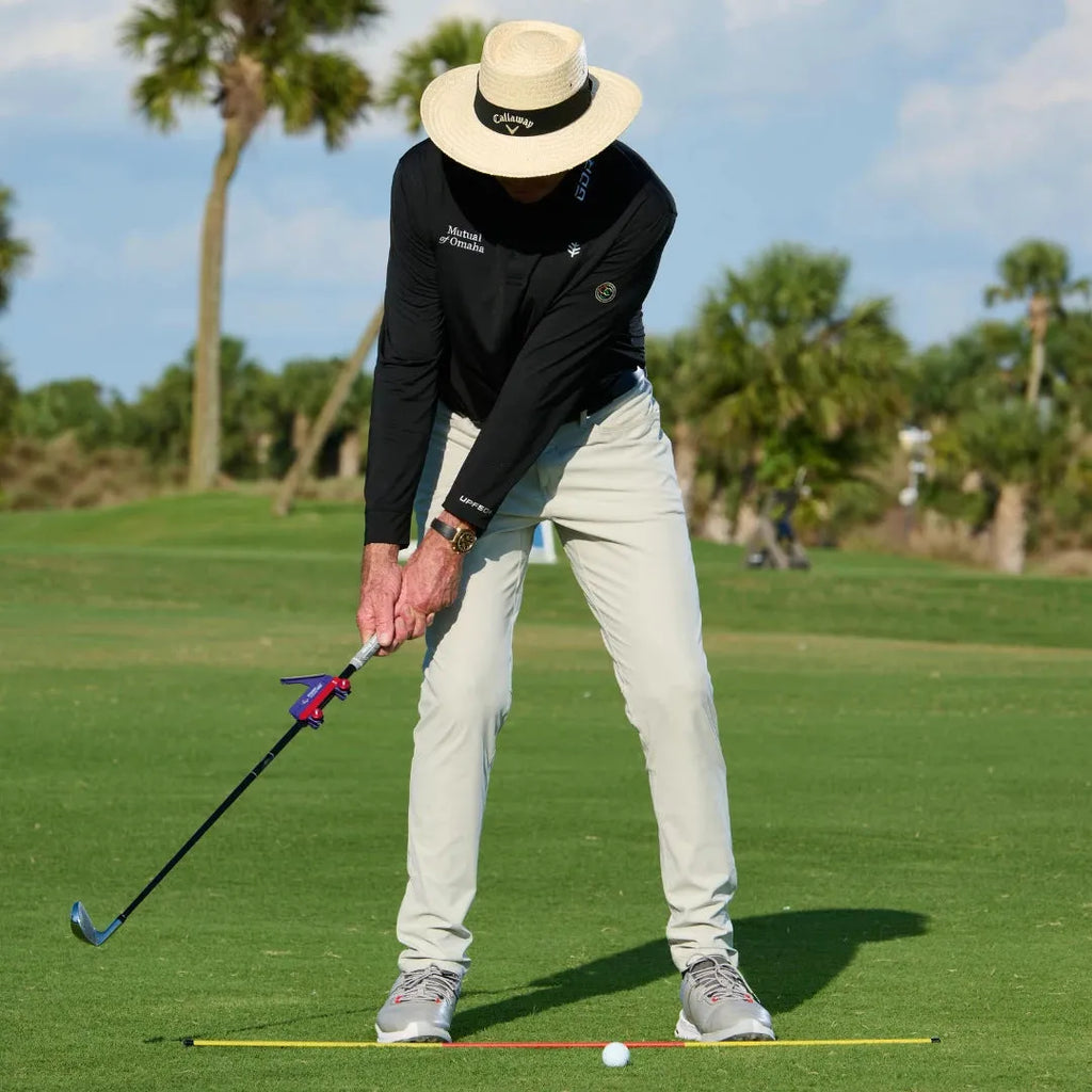 Golf swing plane simulator trainer with plastic construction shown from practice angle