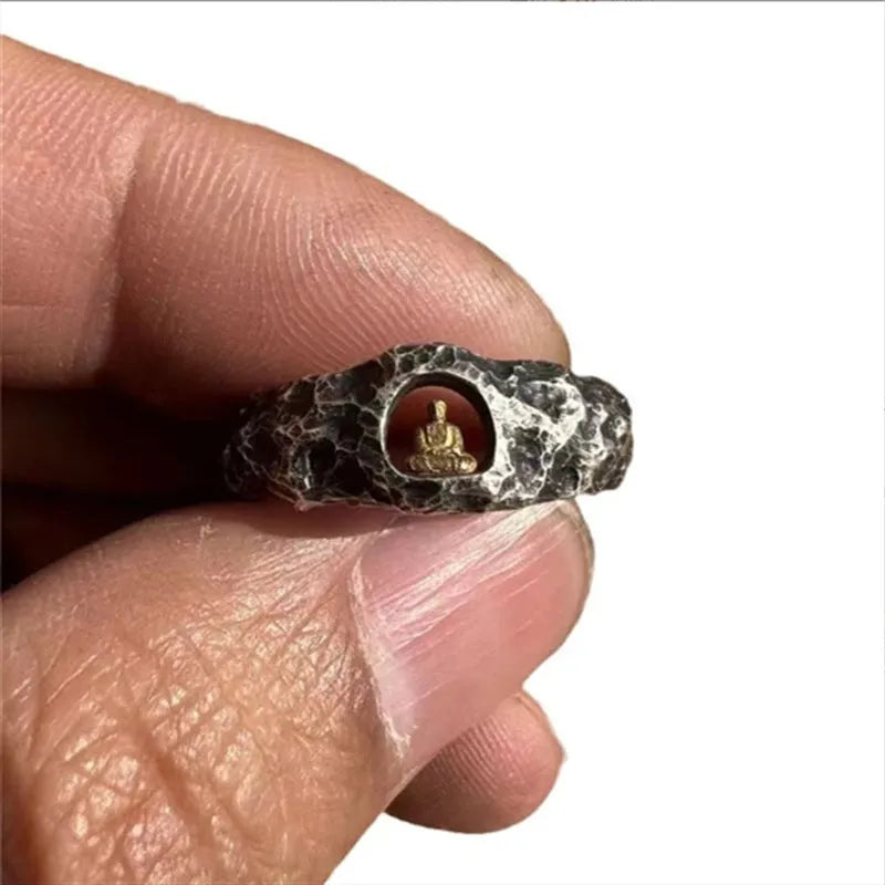 Copper Buddha ring with rock texture surface showing hand-forged details and Buddhist imagery