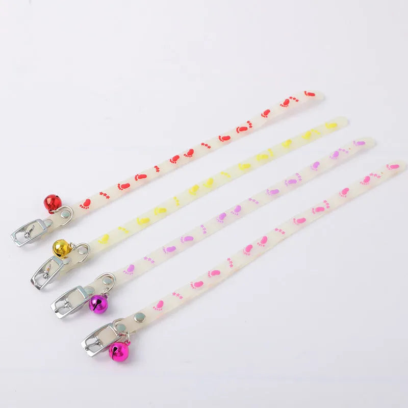 Luminous cat collar with adjustable silicone strap and metal bell in paw print pattern