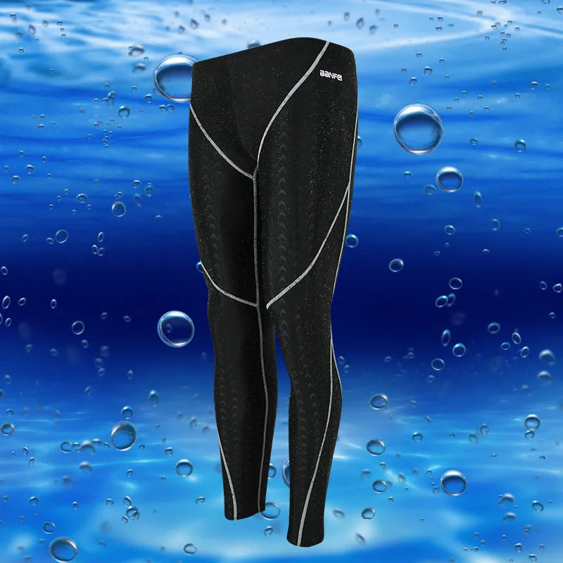 Men's black nylon cropped swimming trunks with a coloured line detail and brief style