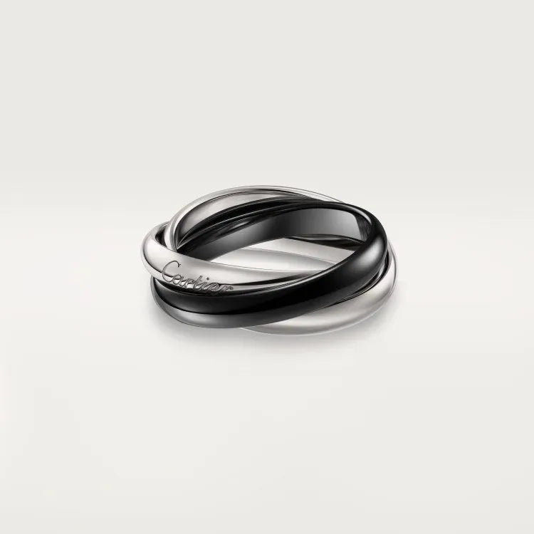 A pair of silver couple rings with full diamond settings, showing U-shaped and geometric band designs on a size 8 finger.