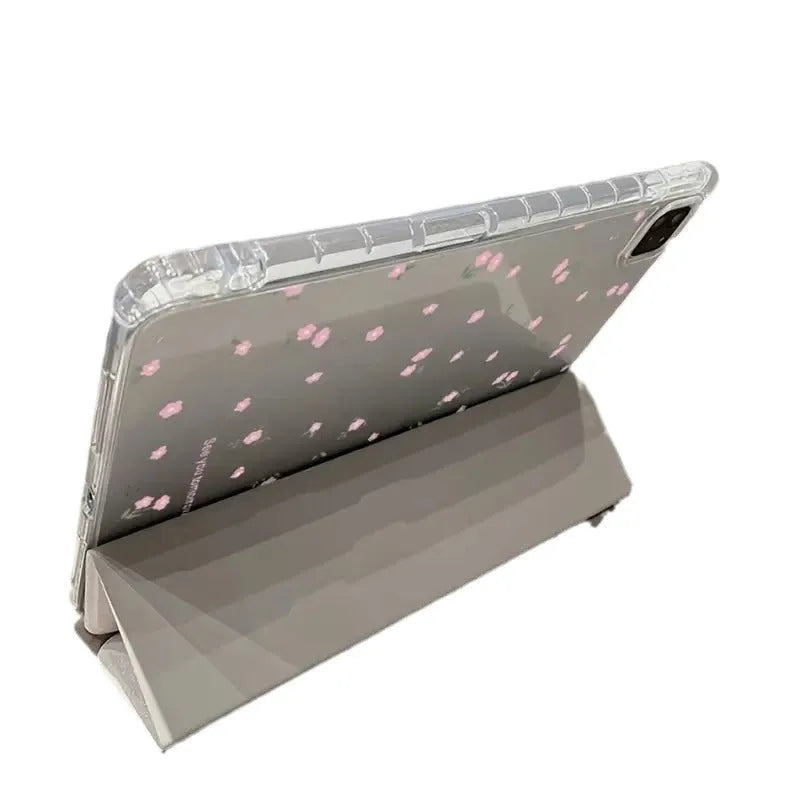 Clear tri-fold iPad case with floral design, shown in stand mode.