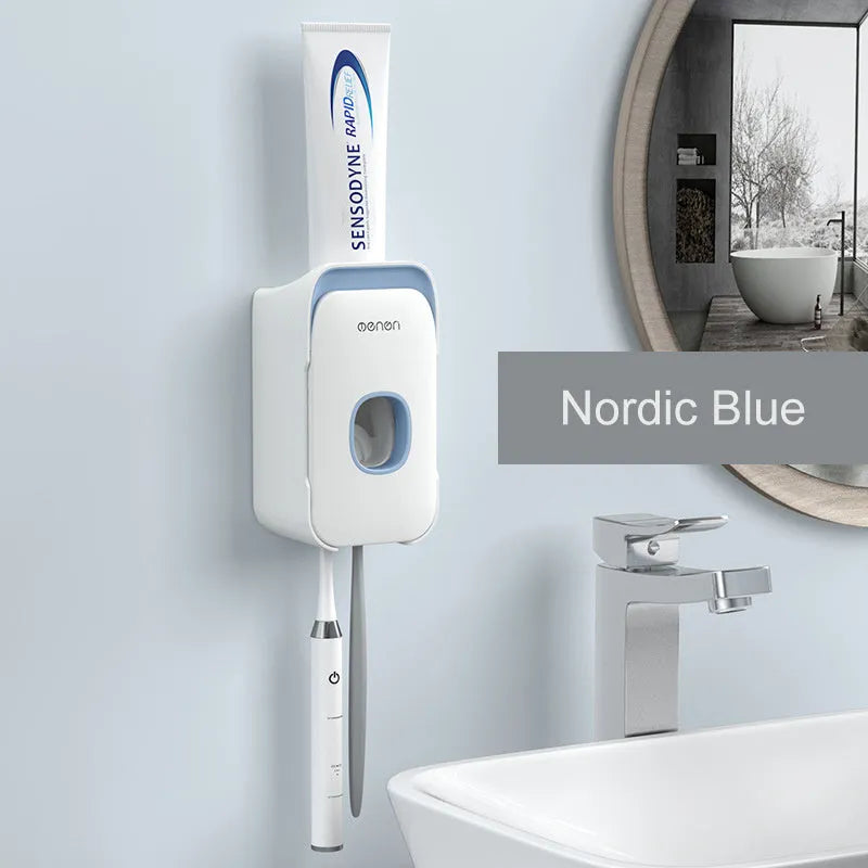 Automatic wall-mounted toothpaste dispenser in blue, grey, and pink colours with USB charging cable.