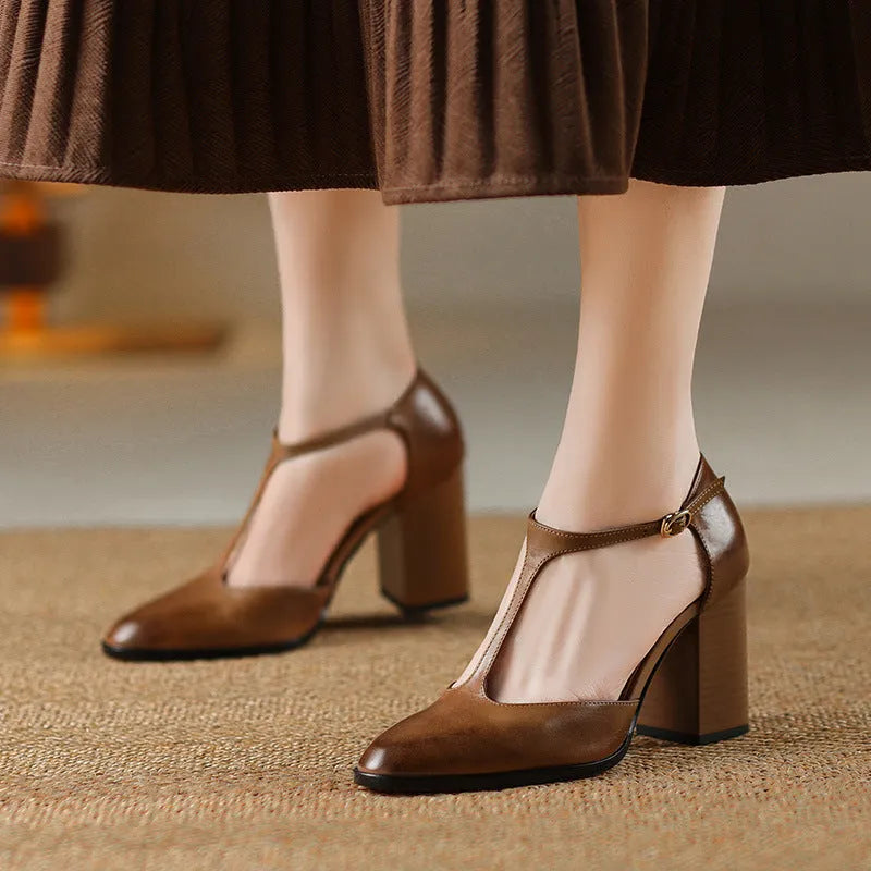 Women's dark brown hollow-out pointed toe buckle heels made from genuine cowhide leather.