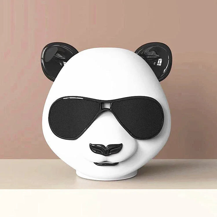 Portable mini Bluetooth speaker with classic styling showing front speaker grill and control buttons