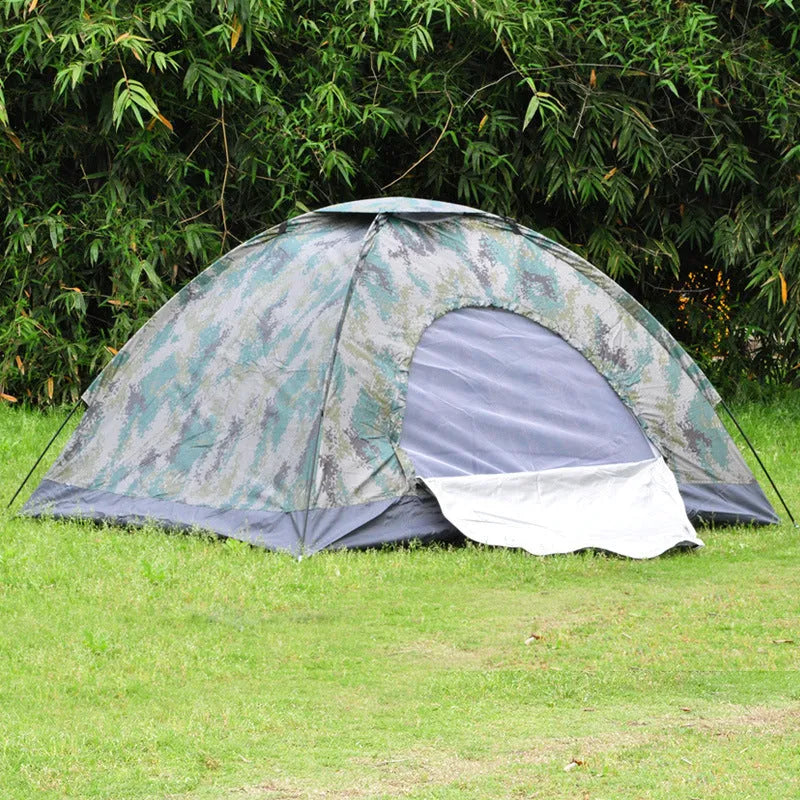Double camouflage pattern tent pitched outdoors with triangular skylight visible