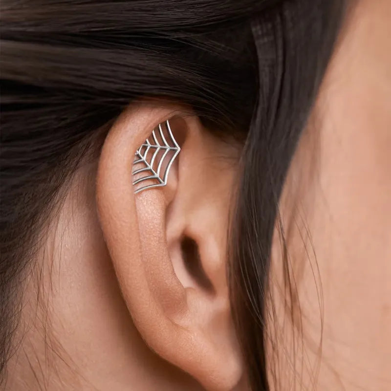 Geometric spider web stud earrings in gold and silver electroplated metal finishes