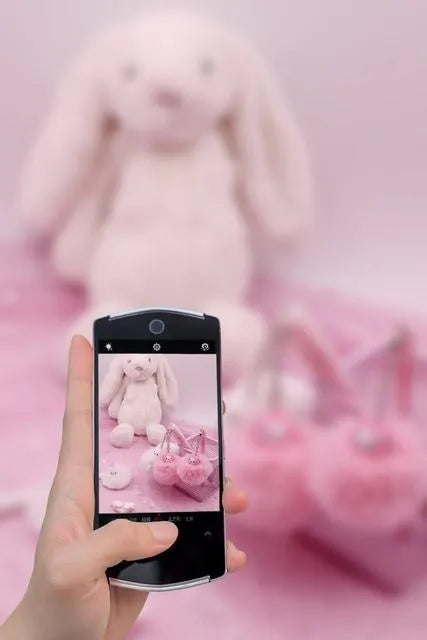 Alpaca hair ball pendant pen with 0.5mm tip and plastic barrel at 17cm length on a flat surface