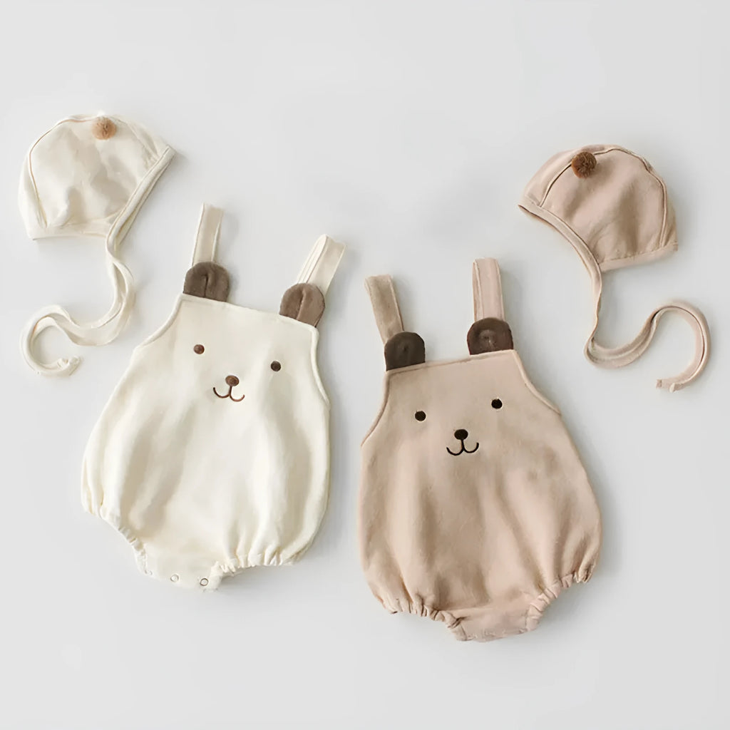 Baby sleeveless cotton robe with detachable hood in white on a soft background