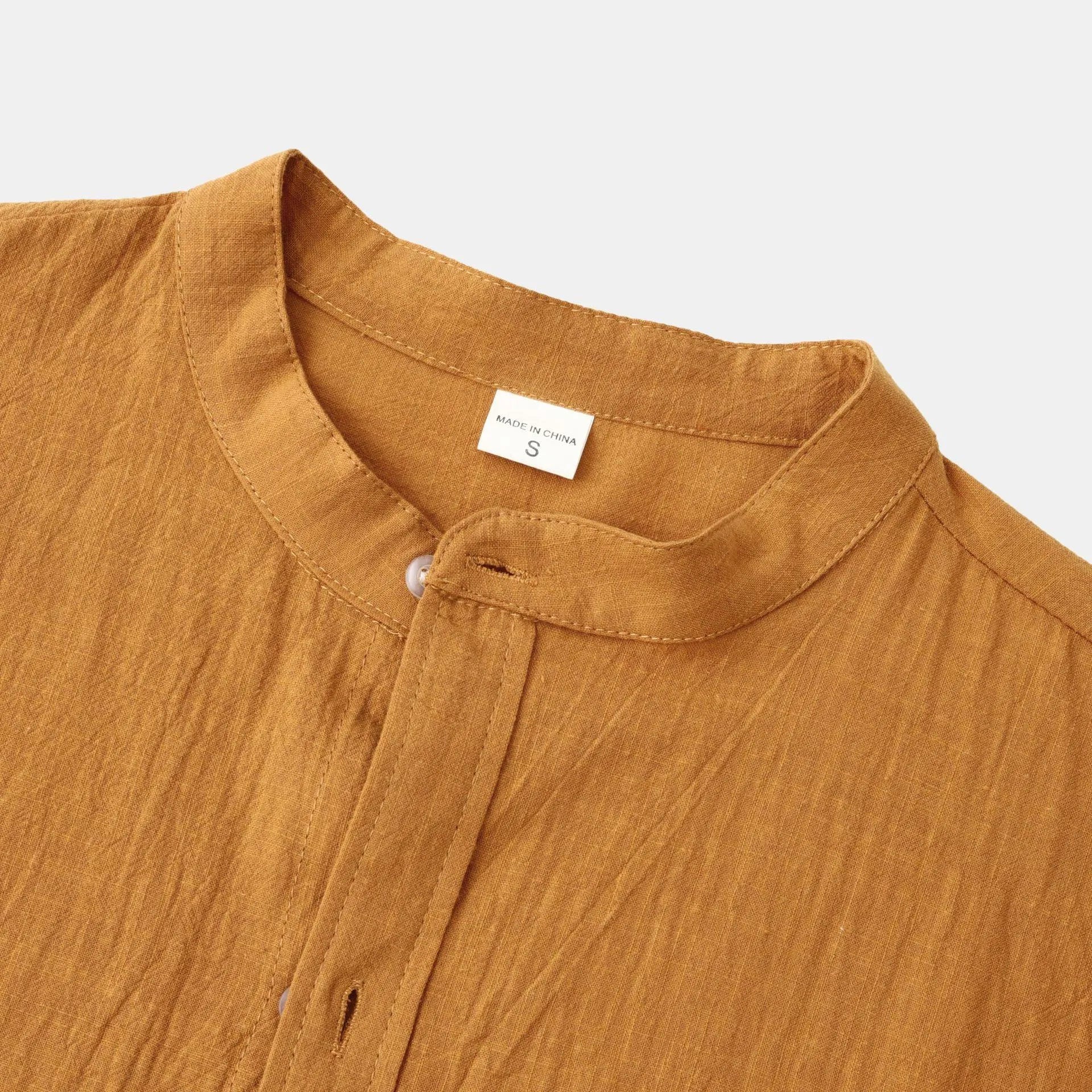 Men's slim fit brown cotton blend long sleeve shirt and pants casual set laid flat.