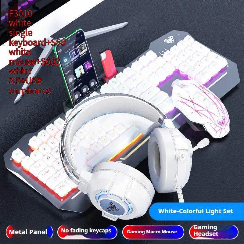 Metal mechanical keyboard bundle with gaming mouse, headset, and optional mouse pad on a desk.