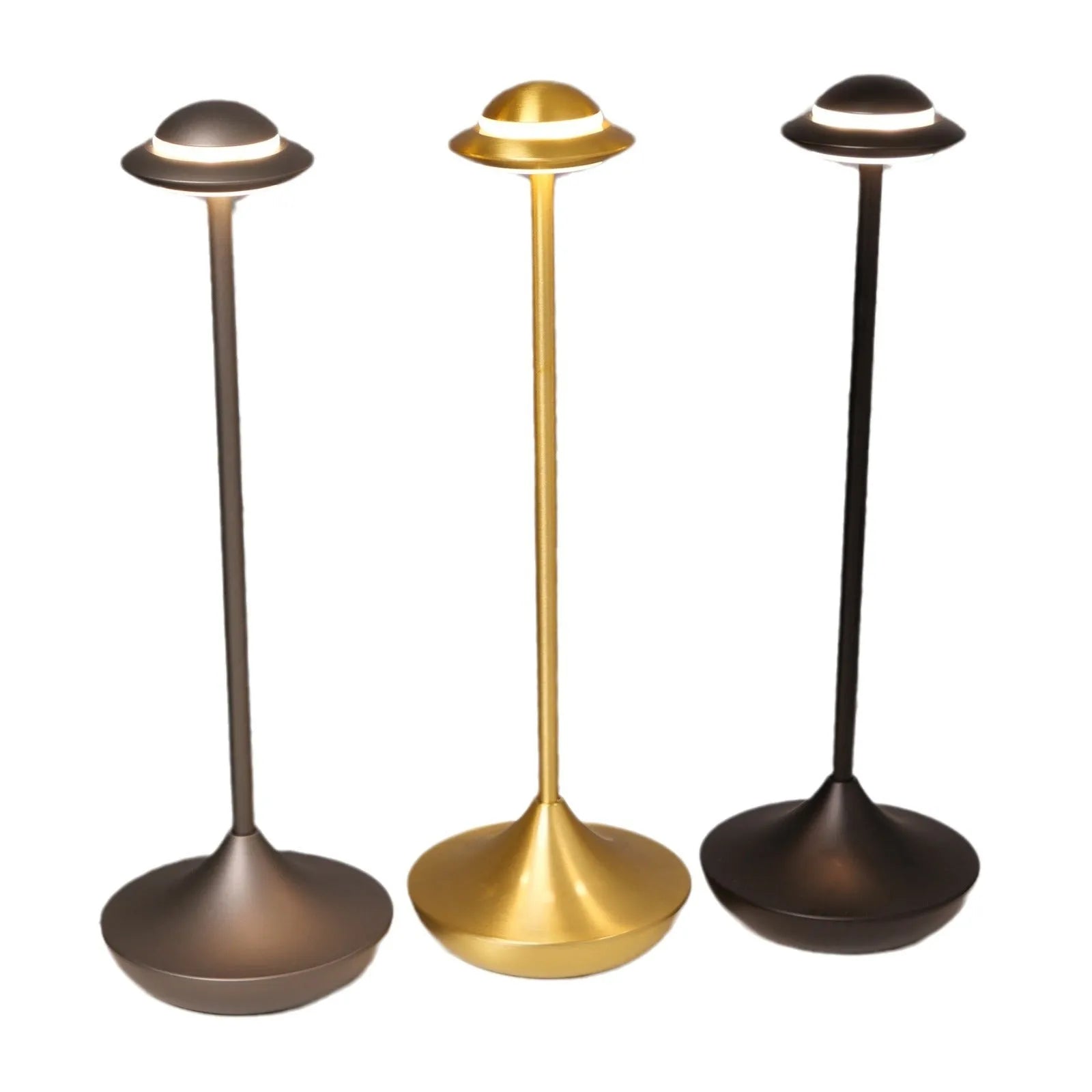UFO-shaped table lamp with metallic finish and touch controls on desk surface