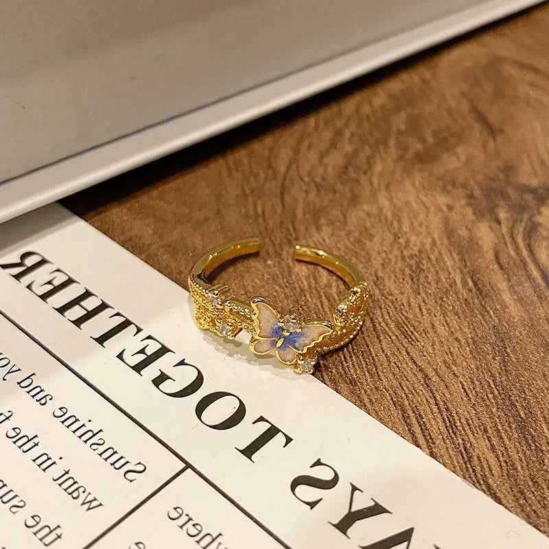 Women's copper butterfly ring with dripping oil finish and adjustable open loop design