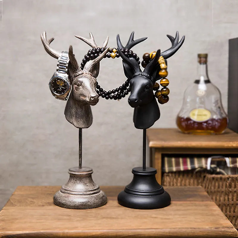 Tall black natural resin animal sculpture for home decoration on a wooden table.