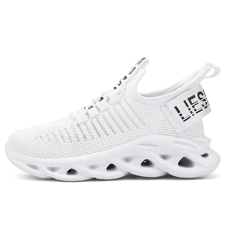 Kids black coconut sneakers with Velcro strap and fabric upper on a non-slip EVA sole.