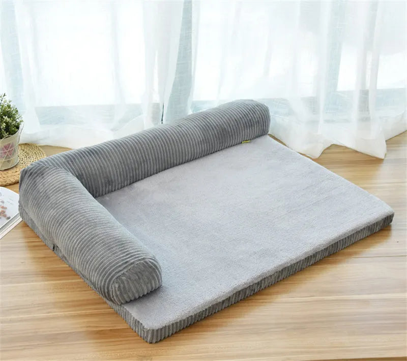 Corduroy pet sofa dog bed in grey colour with a non-slip base, shown in a medium size.