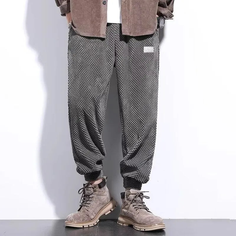 Men's grey ankle-tied sweatpants with straight leg cut and adjustable cuff ties