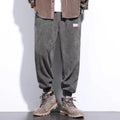 Men's grey ankle-tied sweatpants with straight leg cut and adjustable cuff ties