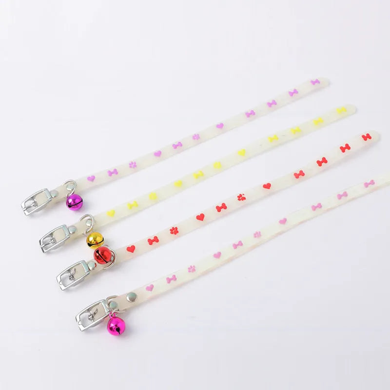 Luminous cat collar with adjustable silicone strap and metal bell in paw print pattern