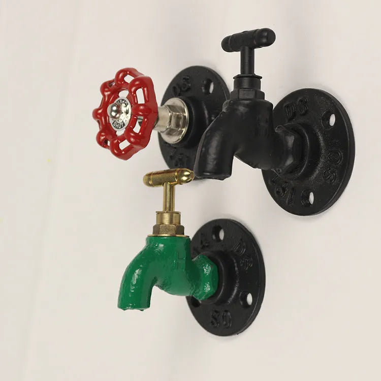 Metal wall-mounted towel rack hook designed like a water pipe, in a polished finish.