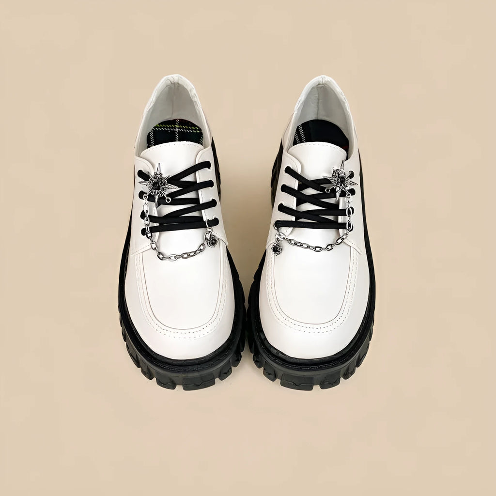 Women's Duke Asterism loafers with preppy style, round toe, and cross strap with metal detail.