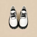 Women's Duke Asterism loafers with preppy style, round toe, and cross strap with metal detail.