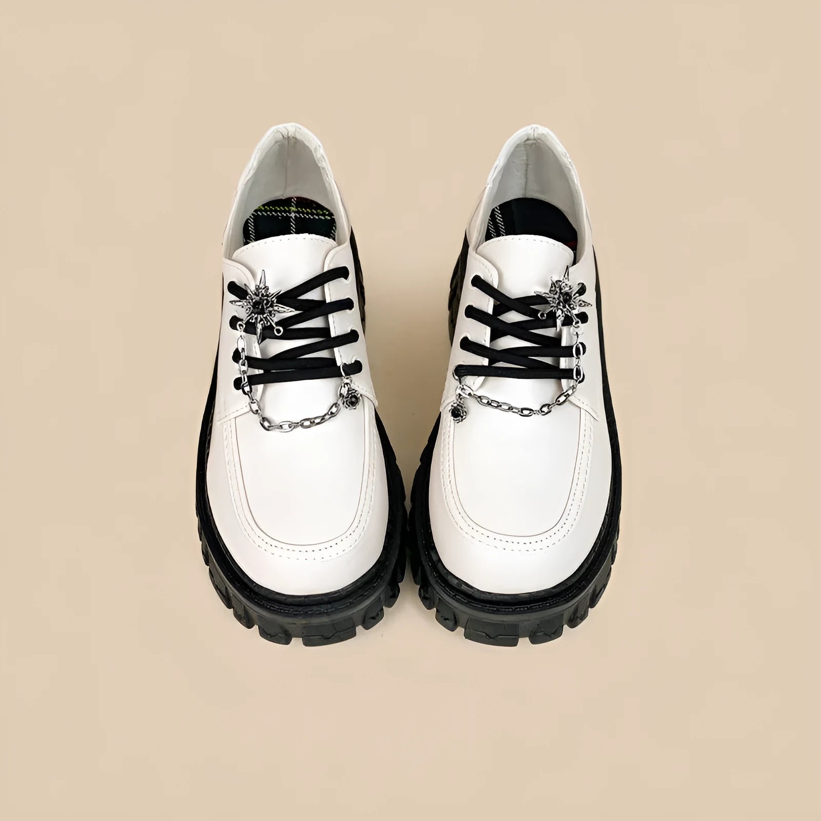 Women's Duke Asterism loafers with preppy style, round toe, and cross strap with metal detail.