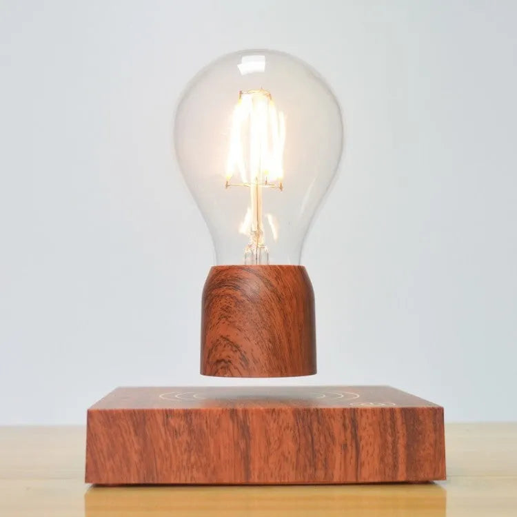 Magnetic levitation floating light bulb with UK plug on imitation wood base.