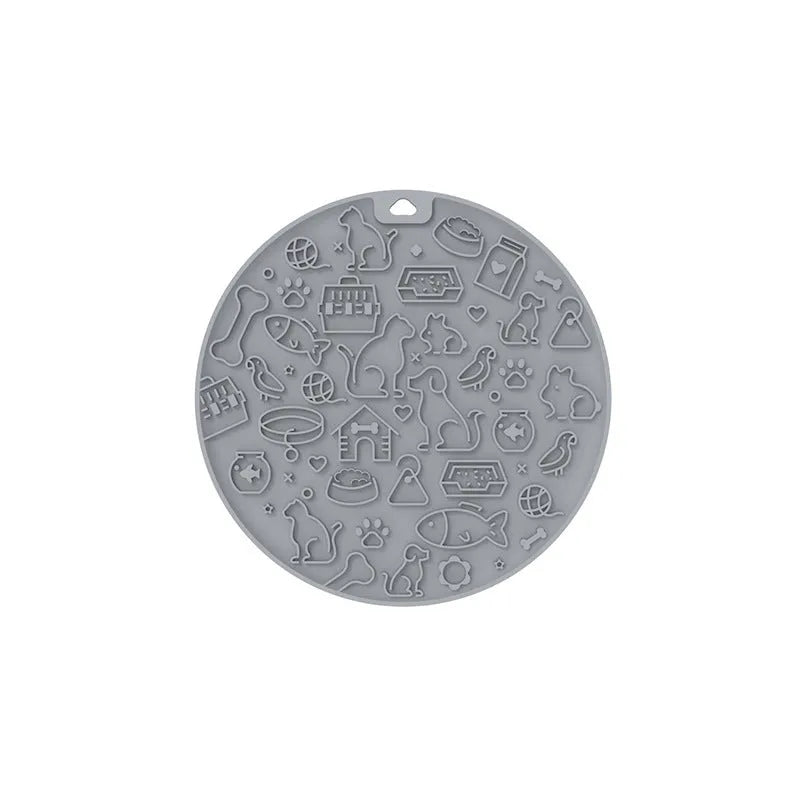 Round blue silicone pet licking mat with suction cup and textured surface for slow feeding.