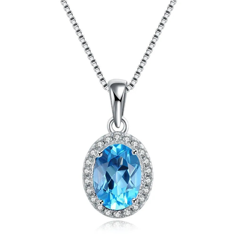 925 sterling silver jewellery set with blue topaz gems including earrings, ring, necklace and pendant