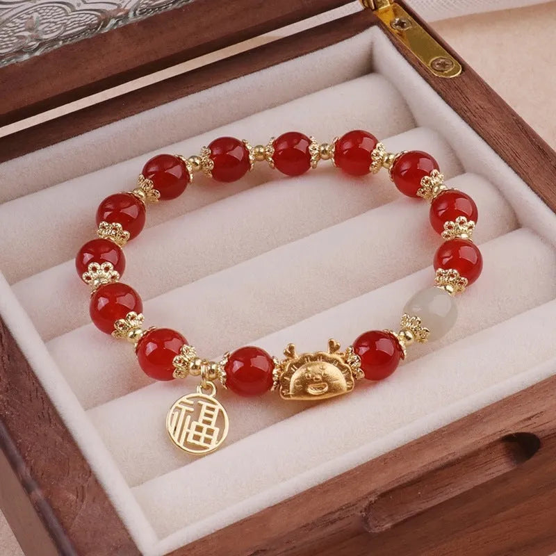 Niche Girlfriends Ice Crack Floral glazed bracelet with red, pink, and white glass beads and a zodiac charm.