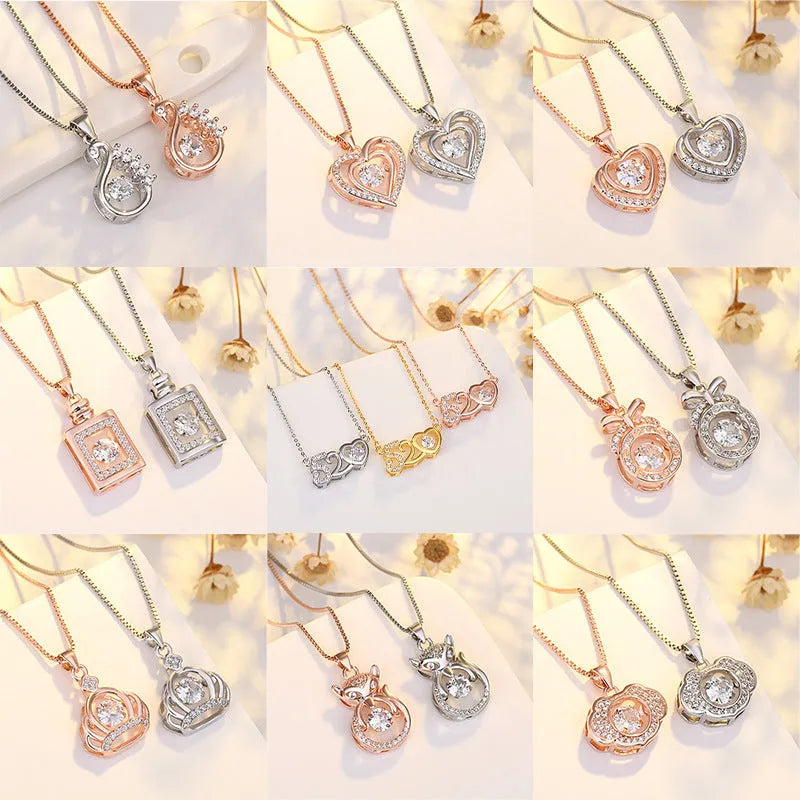 Heart-shaped sterling silver necklace with crown and bow pendant details