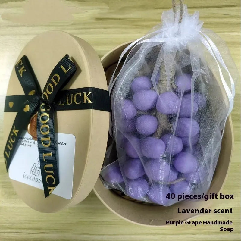Grape handmade soap bars in black, green, purple and litchi variants showing mesh bag, gift box and long case packaging.