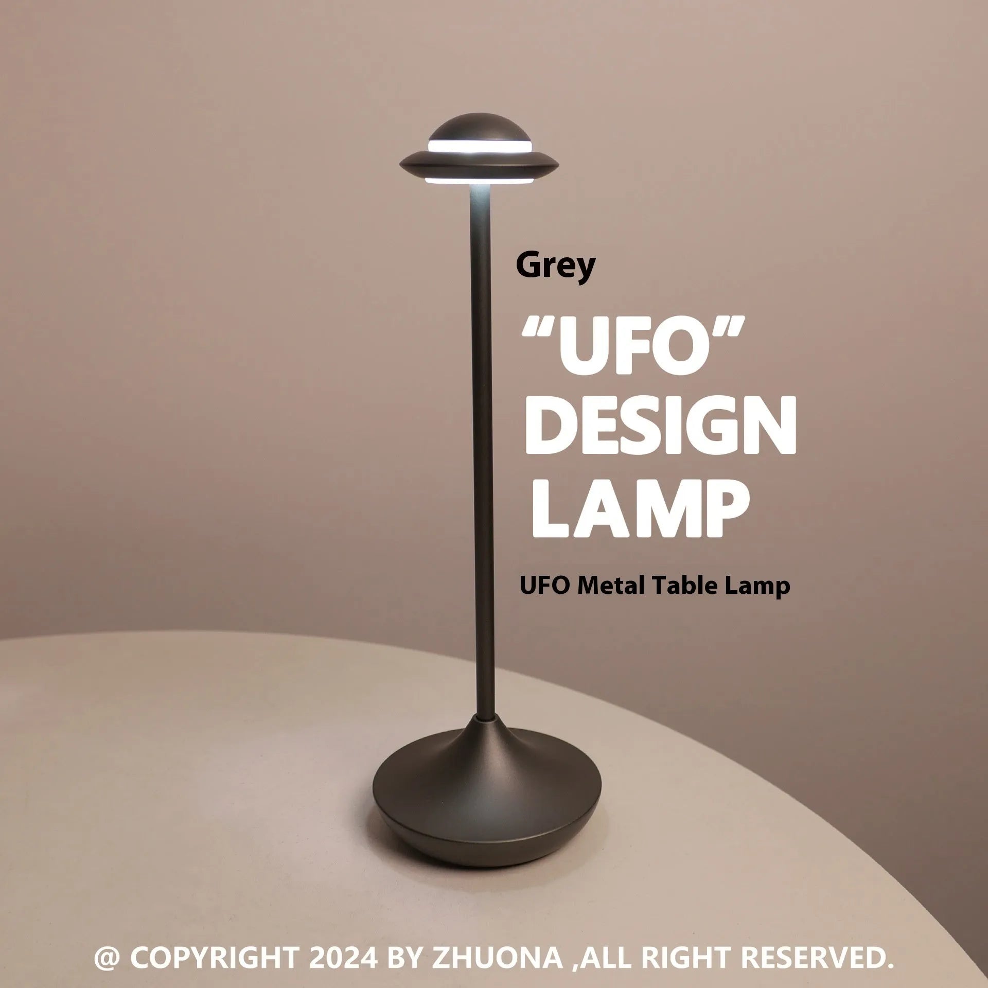UFO-shaped table lamp with metallic finish and touch controls on desk surface