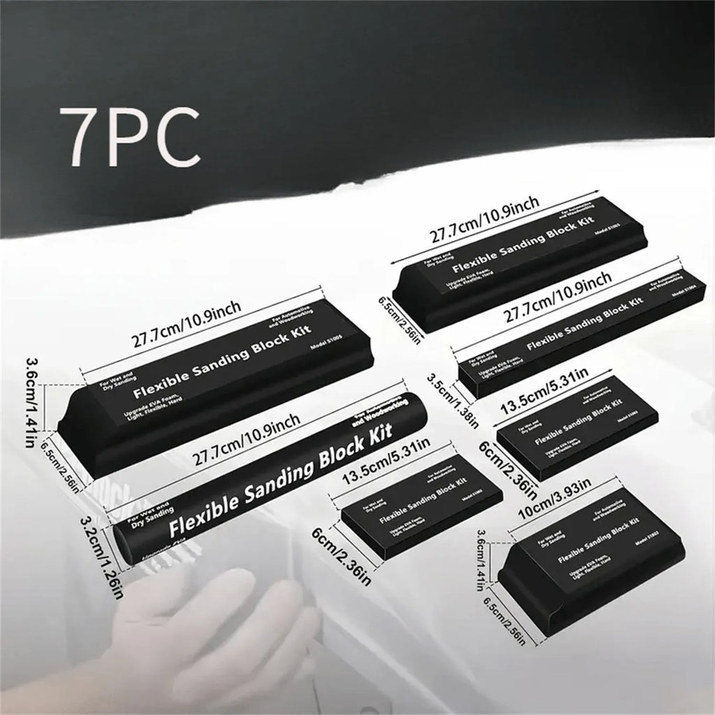 Set of seven identical black frosted metal building blocks for model making