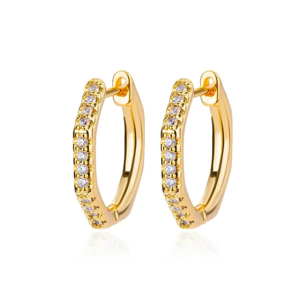 Geometric butterfly-shaped earrings with heart, bow, and star details in copper with a diamond-cut finish.