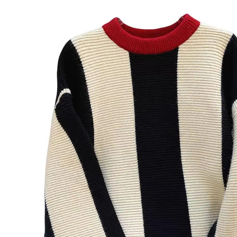 Women's striped cashmere sweater with round neck and contrast colour detailing.