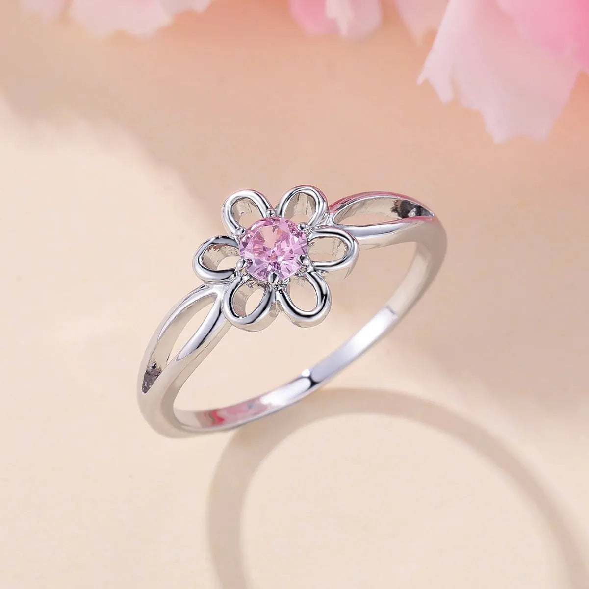 Lady's hollowed floral fashion ring in electroplated copper, platinum pink diamond colour.