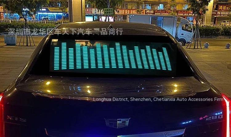 Car interior voice-controlled rhythm light displaying one of its 16 electroluminescent patterns on a 90 by 25 cm panel.
