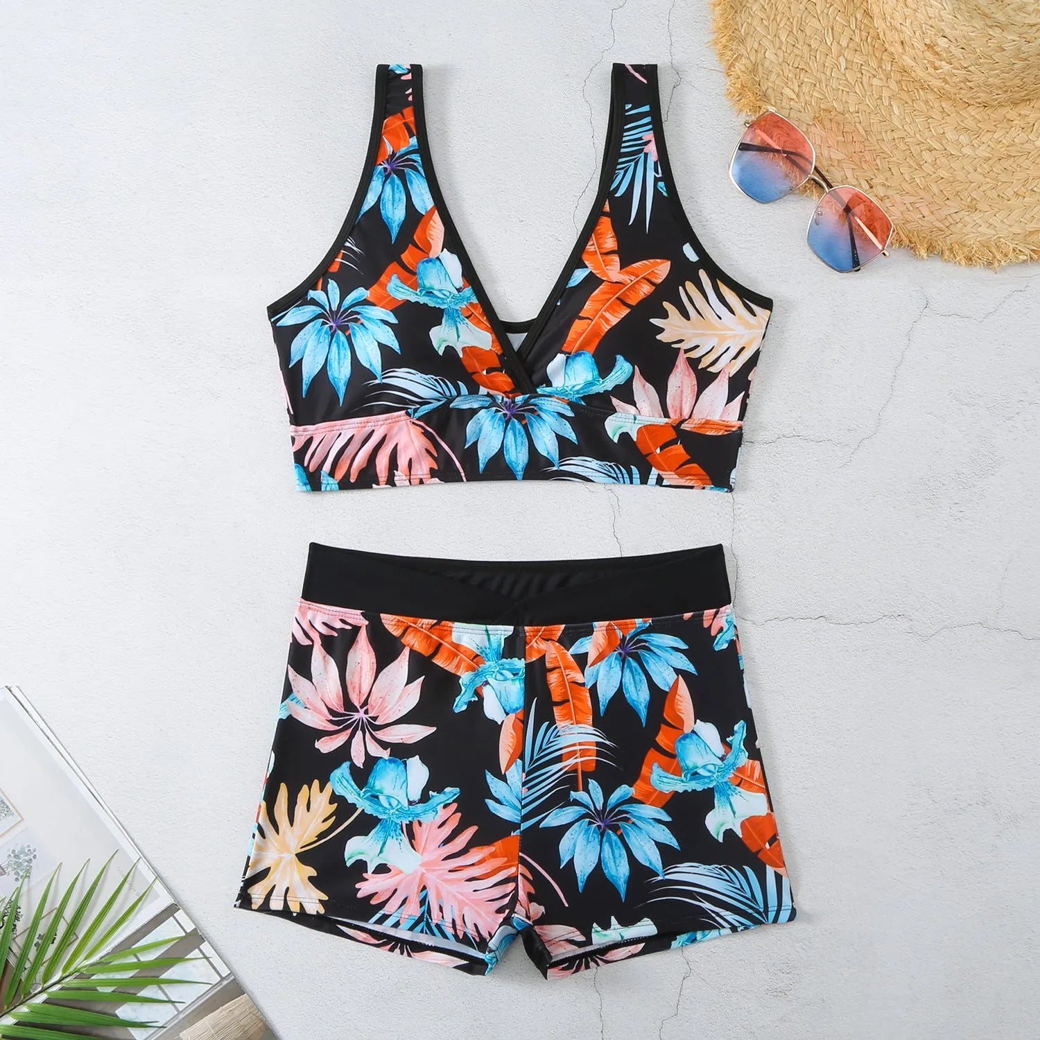 Women's two-piece sleeveless swimsuit with boxer shorts in a multi-colour print.