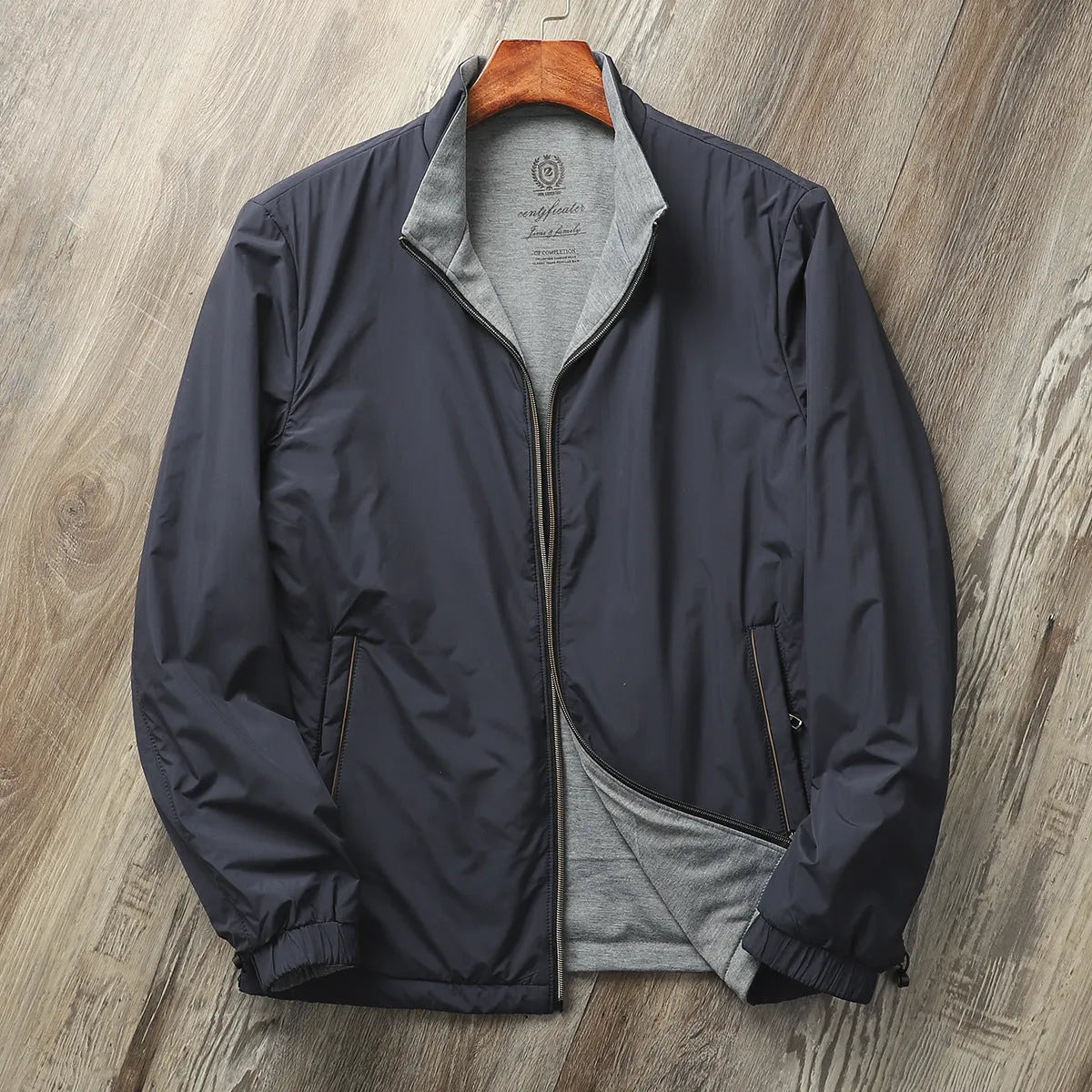 Men's stand collar simple jacket in a polyester blend fabric shown in Army Green colour.