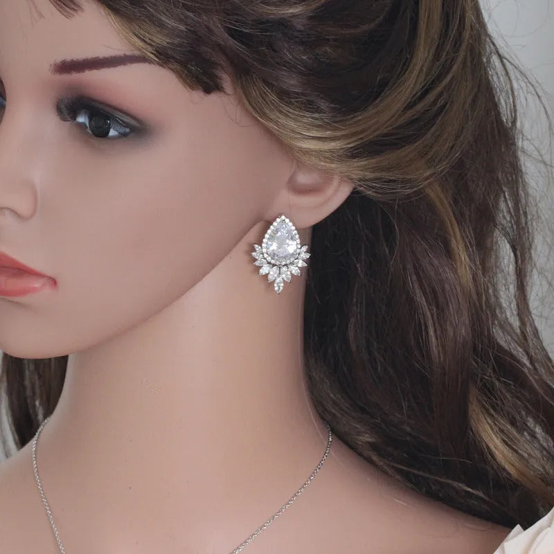 Silver-tone jewellery set with cubic zirconia stones including necklace, bracelet and earrings for formal events