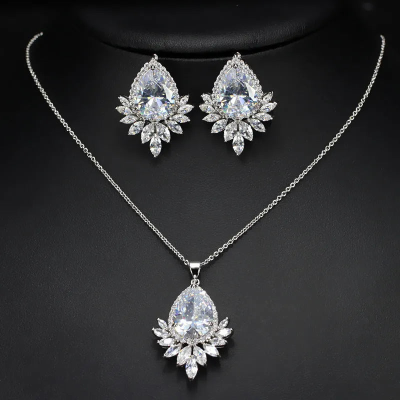 Silver-tone jewellery set with cubic zirconia stones including necklace, bracelet and earrings for formal events