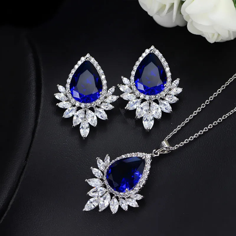 Silver-tone jewellery set with cubic zirconia stones including necklace, bracelet and earrings for formal events