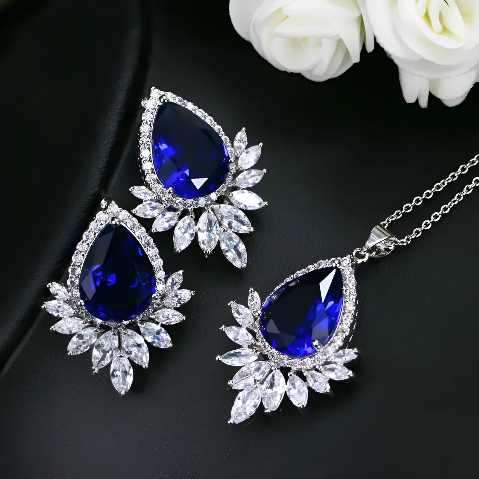 Silver-tone jewellery set with cubic zirconia stones including necklace, bracelet and earrings for formal events