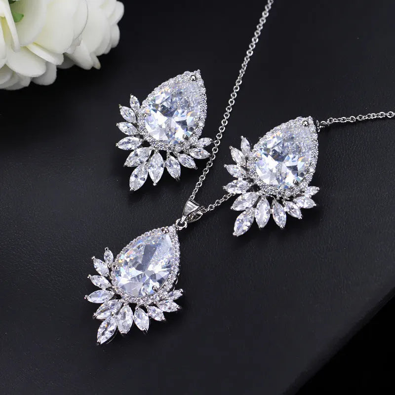 Silver-tone jewellery set with cubic zirconia stones including necklace, bracelet and earrings for formal events