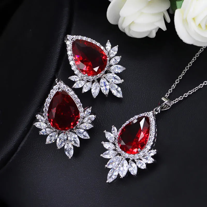Silver-tone jewellery set with cubic zirconia stones including necklace, bracelet and earrings for formal events